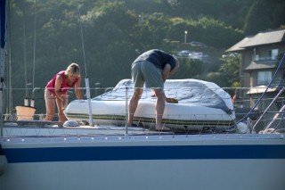 Clean down the deck on a cruising yacht