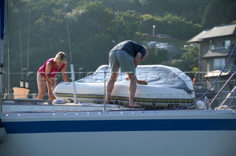 Clean down the deck on a cruising yacht