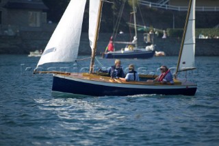 Family sailing a classic yawl