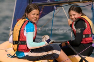 Two girls in sailing dinghy