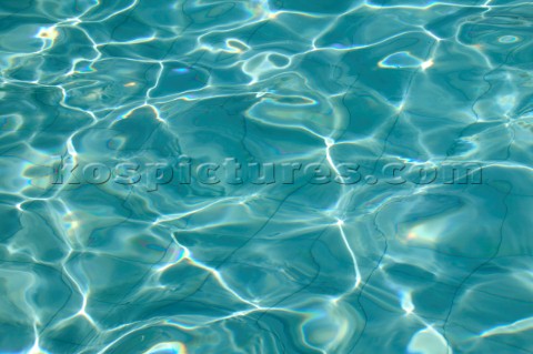 Shimmering surface of water in swimming pool