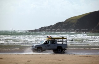 Surf Rescue jeep on sandy beach at Bantham