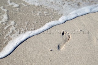 Footprint on wet sand