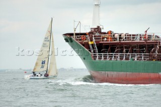 Yacht sailing across the path of a commercial tanker (Power gives way to sail)