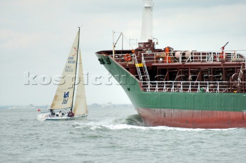 Yacht sailing across the path of a commercial tanker Power gives way to sail