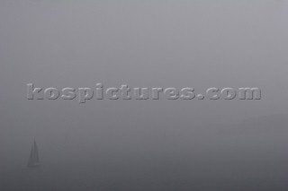 Sailing yacht in thick fog. Porto Cervo, Sardinia