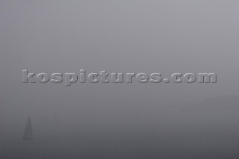 Sailing yacht in thick fog Porto Cervo Sardinia