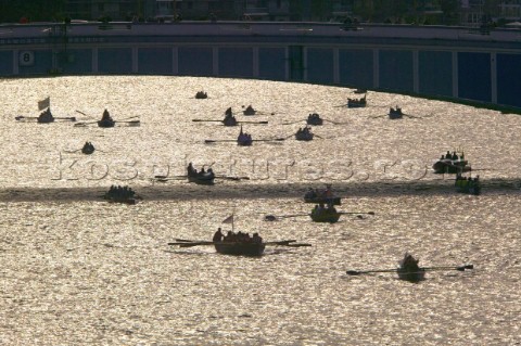 Rowing boats from around Europe compete in the Great River Race down the Thames in London UK