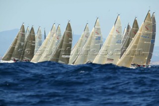 Mumm 30 World Championship 2003. Fleet on the startline behind waves