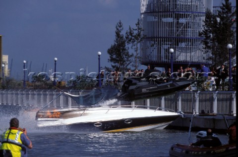 James Bond crashes through a Sunseeker powerboat in his jet boat during a dangerous stunt in the mov