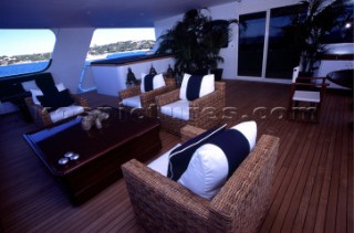 Relaxation seating area with chairs. Flavio  Briatore Managing Director of Renault F1 Team France in Viry-Châtillon, on board of his yacht Force Blue. SALES ONLY FOR UK