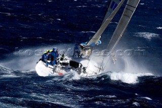 Skandia sailing along the Tasmanian coast, Australia. 85 yachts of all sizes battled for this years line honors in this the 61st running of the world famous race.