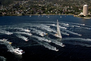 Sailing and racing yachts leave Sydney harbour in the 2005 Rolex Sydney Hobart race