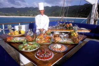 Cordon Bleu cook chef serves an impressive food display for eating lunch or dinner