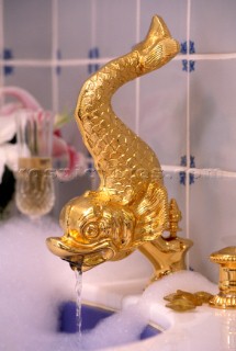 Gold plated interior bath tap onboard a superyacht