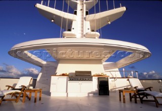 Communication and aerials and masts onboard a superyacht, with relaxing BBQ area.