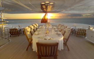 Outside stern dining area onboard a superyacht