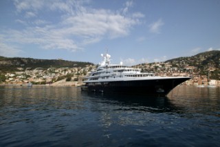 Superyacht at anchor in a tranquille bay