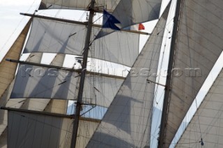 Graphic sails and shapes of the masts and sails of a cruising superyacht cruise ship