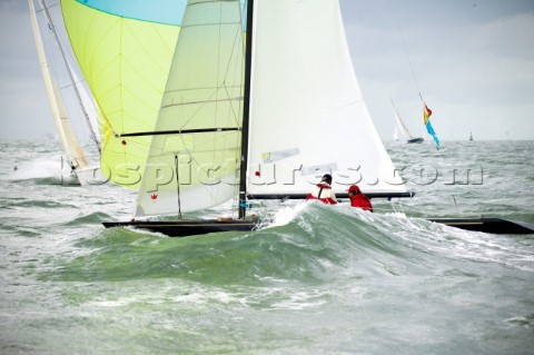 COWES ENGLAND  AUGUST 1 A breaking wave soaks the crew of a Dragon one design boat during day 4 of S