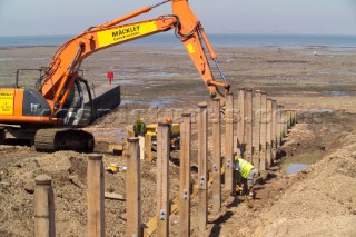 Sea defence building in whitstable kent raising the level of the beach some meters to counter rising sea level and erosion new breakwater being built
