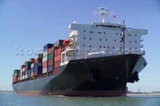 A container ship fully laden near to port