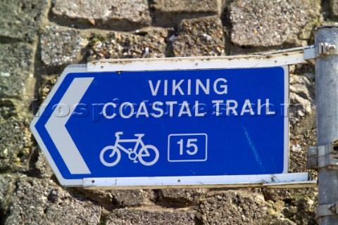 Blue tourist sign showing a Viking Coastal Trail suitable for cyclists