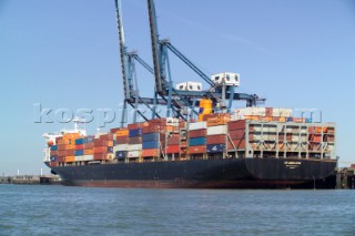 The unloading of a commercial container vessel