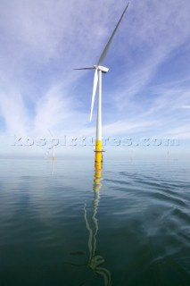 Windmills in a wind farm in sea estuary