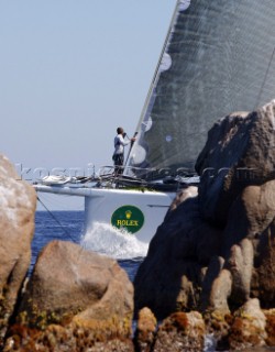 PORTO CERVO, SARDINIA - SEPT 6th 2006: The bowman prepares the asymmetric spinnaker on the 100ft canting keel super-maxi Alfa Romeo owned by Neville Crighton (NZL) leading the racing fleet at the Maxi Yacht Rolex Cup 2006 in Porto Cervo, Sardinia. (Photo by Tim Wright/Kos Picture Source via Getty Images)