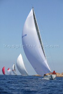 PORTO CERVO, SARDINIA - SEPT 6th 2006: The Swan mini maxi Flying Dragon owned by Paolo Scerni under asymmetric spinnaker leading the giant cruising maxi Unfurled and other maxi yachts at the Maxi Yacht Rolex Cup 2006 in Porto Cervo, Sardinia. (Photo by Tim Wright/Kos Picture Source via Getty Images)