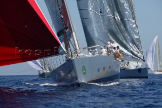 PORTO CERVO, SARDINIA - SEPT 6th 2006: The gigantic 37 metre maxi yacht Ghost (USA) owned by Arne Glimcher sets her huge red asymmetric spinnaker ahead of the Cruising Division fleet at the Maxi Yacht Rolex Cup 2006 in Porto Cervo, Sardinia. (Photo by Tim Wright/Kos Picture Source via Getty Images)