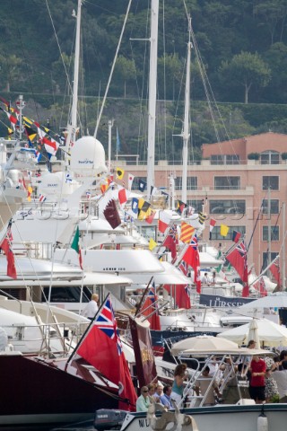 Flags Ensigns mostly British and pennants and courtesy flags on superyachts dressed overall moored s