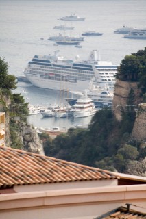 Mega yachts and superyachts moored in Monaco harbour, where cruise ships now also have berths