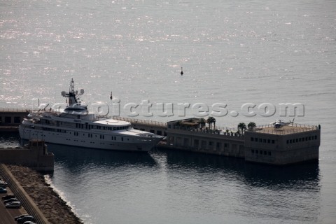 Superyacht moored next to a luxury house with helicopter  Port de Cap DAil France