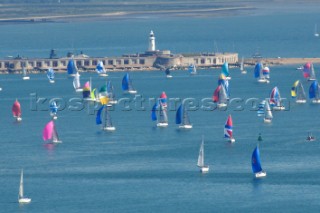 ISLE OF WIGHT, UNITED KINGDOM - JUNE 3:  Over 1,600 yachts race past Hurst Point from the Royal Yacht Squadron startline off Cowes, anticlockwise around the Isle of Wight in the annual JP Morgan Round the Island Race 2006, one of the biggest yacht races in the world.