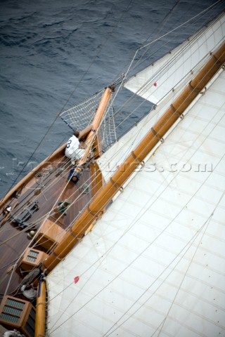 SAINTTROPEZ FRANCE  The bowman checks the rigging on the classic gaff rigged yacht Mariquita whilst 