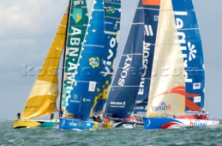 PORTSMOUTH, UNITED KINGDOM - MAY 29: Four Volvo 70s, (from left) ABN AMRO 1, Brazil 1, Sony Ericsson and Brunel line up on the start of the inshore race off Portsmouth. The yachts are early and flog their sails to spill wind and slow down, trying to hit the line as the gun goes. The Volvo Ocean Race 2005-2006 fleet race in each port between the long distance legs.