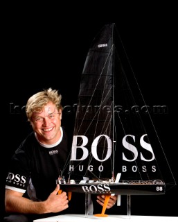 BILBAO, SPAIN - October 22nd 2006: Alex Thomson (GBR) skipper of Open 60 monohull HUGO BOSS with a model of his boat. The Velux 5 Oceans is a three part round the world yacht race for the bravest of solo sailors. Leg 1 is approximately 12,000 miles from Bilbao in Spain to Fremantle in Western Australia. It is the ultimate test of sailing skill, stamina and endurance. (Rights restrictions may apply)
