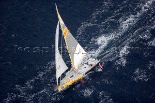 BILBAO, SPAIN - October 22nd 2006: Bernard Stamm (SUI), sailing onboard his Open 60ft Monohull  CHEMINƒES POUJOULAT. The Velux 5 Oceans is a three part round the world yacht race for the bravest of solo sailors. Leg 1 is approximately 12,000 miles from Bilbao in Spain to Fremantle in Western Australia. It is the ultimate test of sailing skill, stamina and endurance. (Rights restrictions may apply)