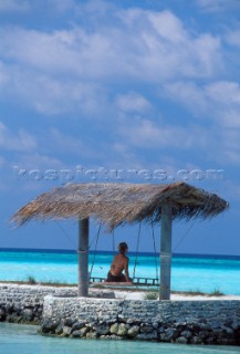 Maldives -. Ranveli Resort -. Relaxing on the beach.