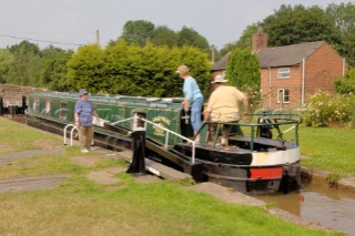 Passing through the lower locks at Grindley Brook,Llangollen canal,Whitchurch,Shropshire,England.July 2006.