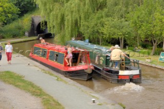 Two boats meeting just below Grindley Brook locks,Llangollen canal,Whitchurch,Shropshire,England.July 2006.