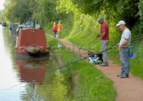 Narrow boatsfishermen and walkers by bridge 14 on the Shropshire Union canal at BrewoodStaffordshire