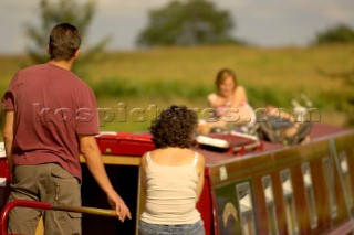 Family on narrow boat on the Llangollen canal at Bettisfield,Clwyd,Wales,August 2006.