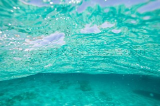 Shimmering water effect of photograph taken from just below waterline in shallow water