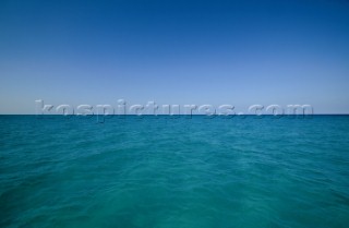 Sea meets sky in perfect symmetry in this two tone image