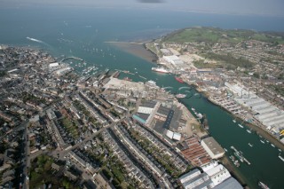 Aerial image of mouth of River Medina at Cowes Isle of Wight showing the marinas in West Cowes and the Red Funnel ferry terminal in East Cowes