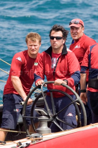 Americas Cup helmsman driving yacht
