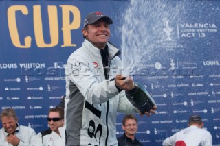 Ernesto Bertarelli of Alinghi celebrating with champagne